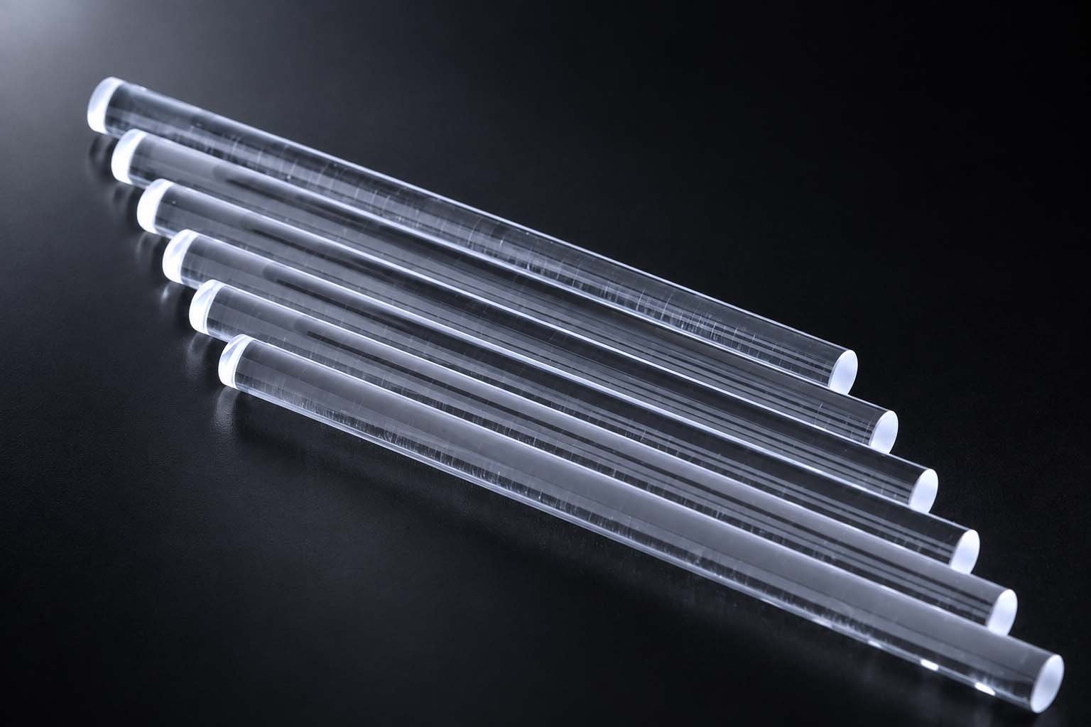 Clear continuously drawn quartz rods arranged by length for fused quartz rods