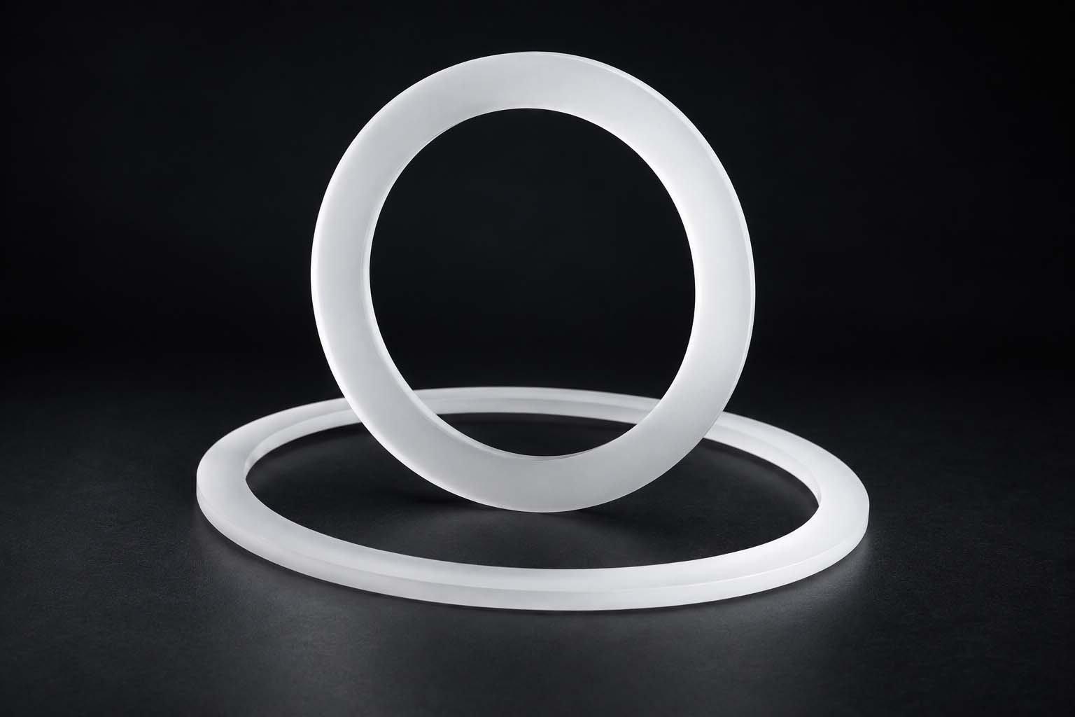 Two milky quartz rings showing flat machined seating faces for quartz rings